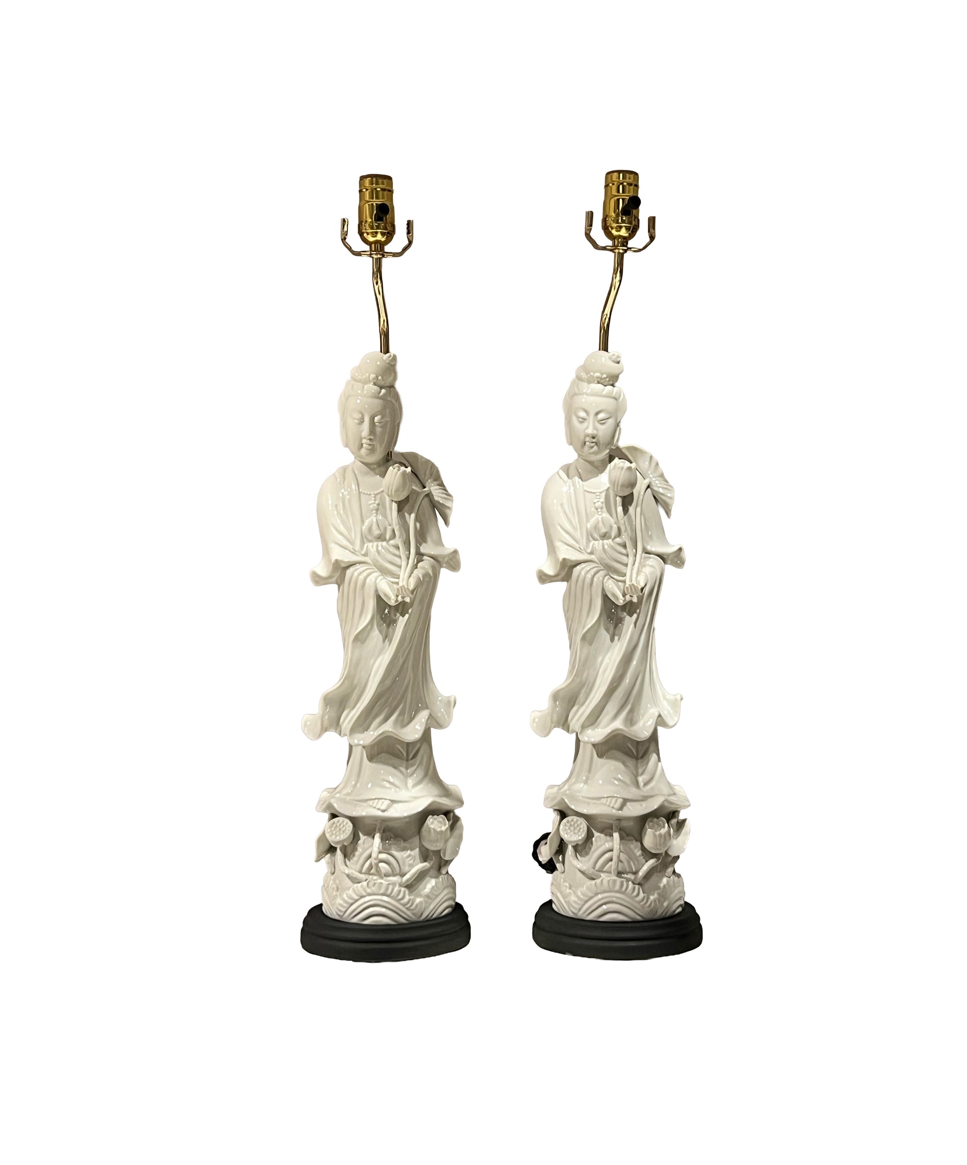 Pair of white porcelain Guanyin figure table lamps, front view with brass sockets