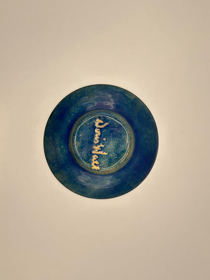 Underside of Doris Hall turquoise enamel dish, signed 'Doris Hall' in gold cursive script