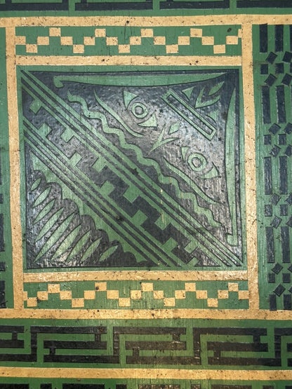 Close-up of green tray center: black and green abstract geometric decoupage motif with gilt frame