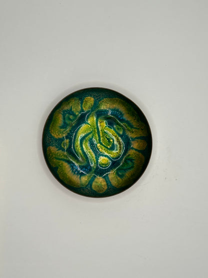 Doris Hall small enamel-on-copper dish, top view of green, yellow and teal abstract swirl glaze
