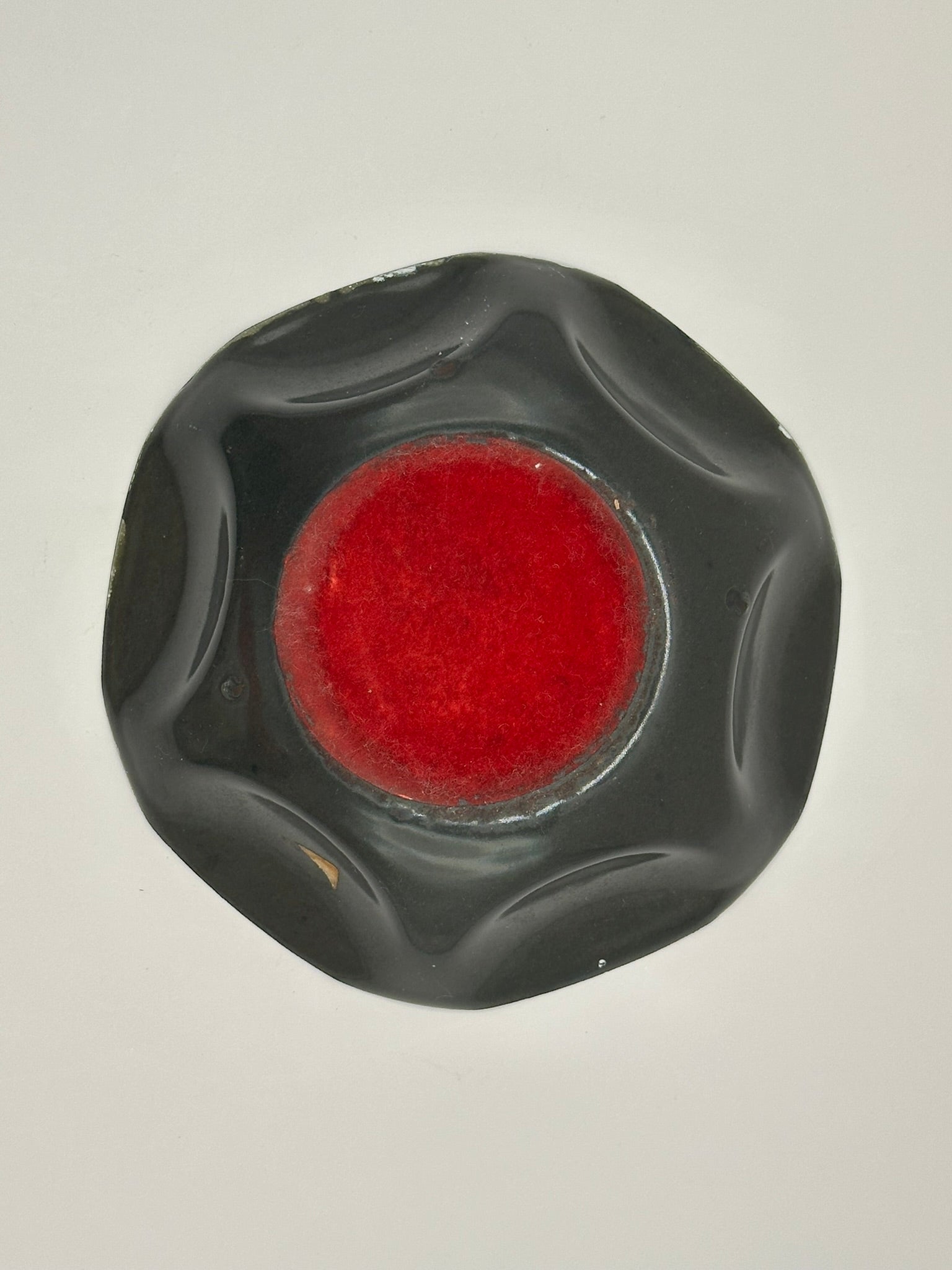 Vintage MCM enamel dish, black underside with red enamel center and ruffled rim