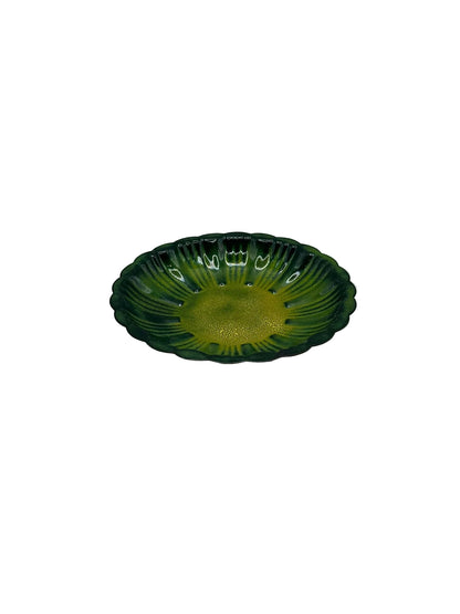 Vintage MCM green striped enamel dish, angled side view of scalloped fluted bowl