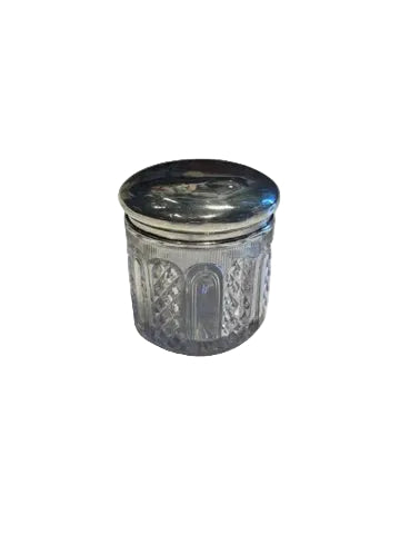 Vintage cut glass and sterling silver vanity jar, angled view of the closed jar with domed silver lid.