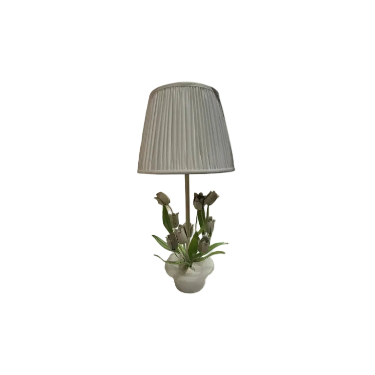 Vintage tole lamp with white-painted metal tulips on an alabaster base, topped by white pleated shade