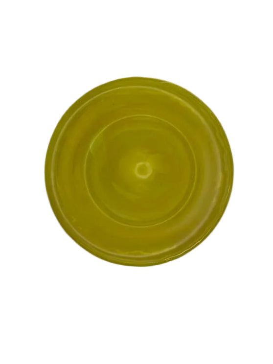 Overhead view of the vibrant citron-yellow art glass bowl
