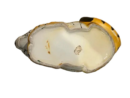 Vintage ceramic tiger planter, underside showing the white unglazed base.