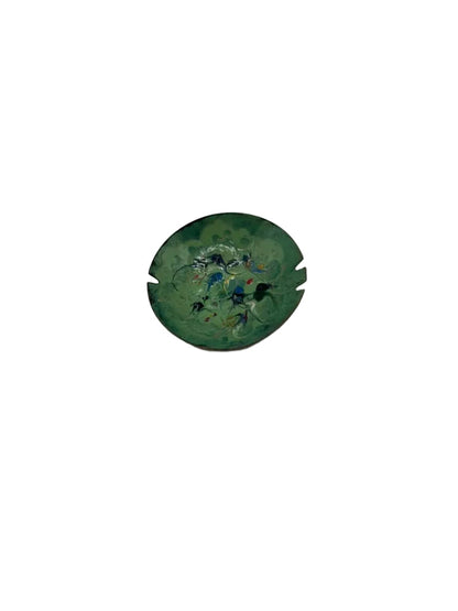 Vintage MCM enamel-over-copper ashtray, angled view of green multicolor enamel dish