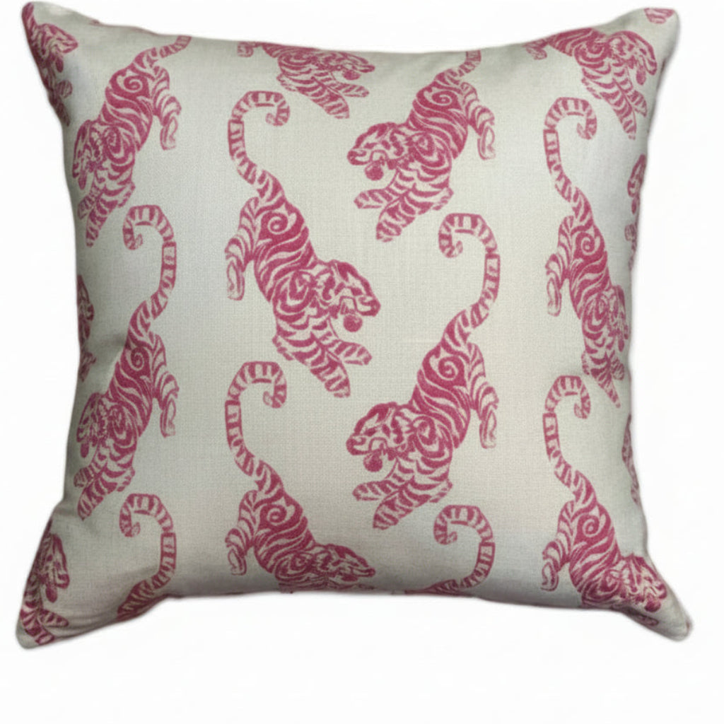 Throw pillow in pink tiger block-print on cream linen, full front view with down insert