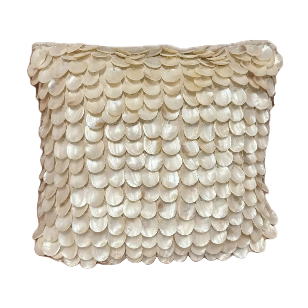 Square throw pillow covered in overlapping cream mother-of-pearl shell discs