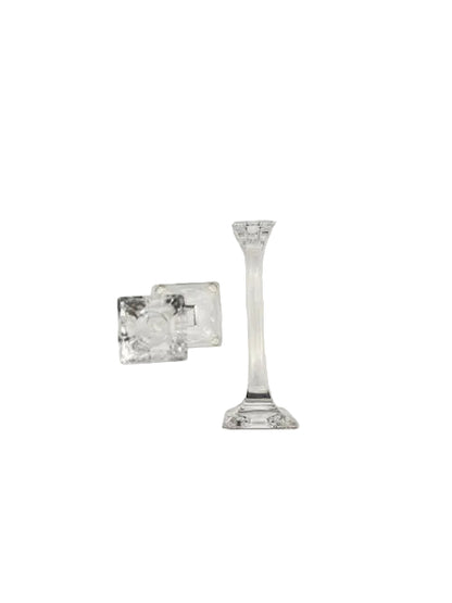 Tiffany & Co. crystal candlestick upright with a second on its side showing the candle cup and base