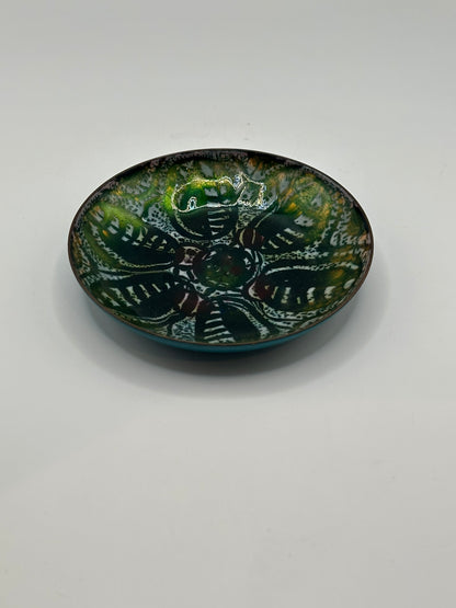 Doris Hall enamel dish at an angle, green and white abstract design with turquoise edge