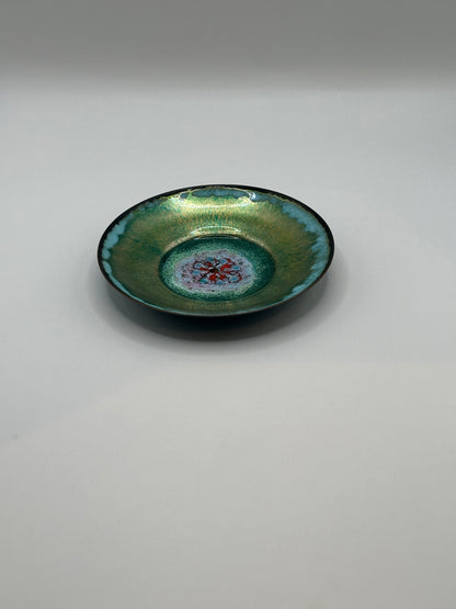 Doris Hall petite green enamel dish, angled view of red and turquoise floral glaze center