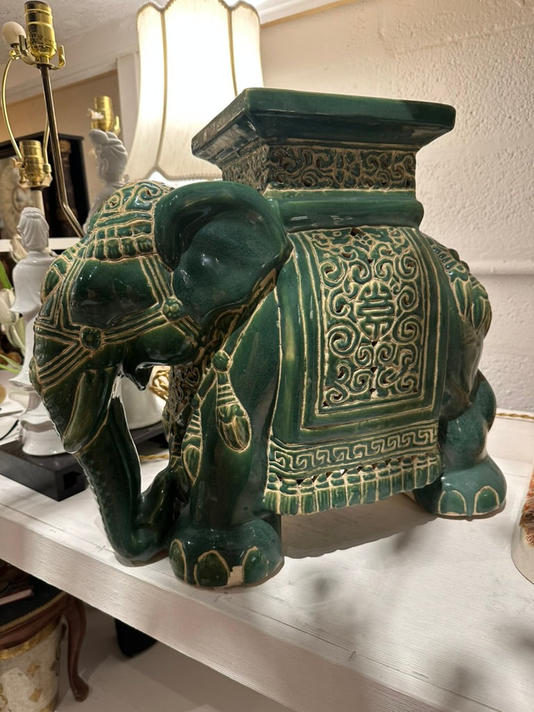 Green ceramic elephant garden stool, angled view showing embossed decoration and square seat top