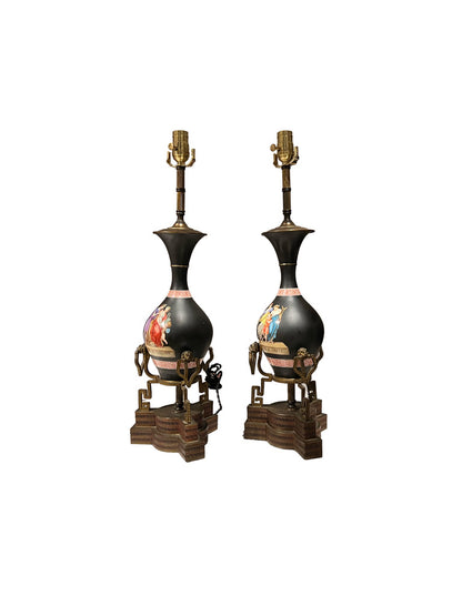 Pair of black neoclassical lamps at three-quarter angle showing the painted figural panels