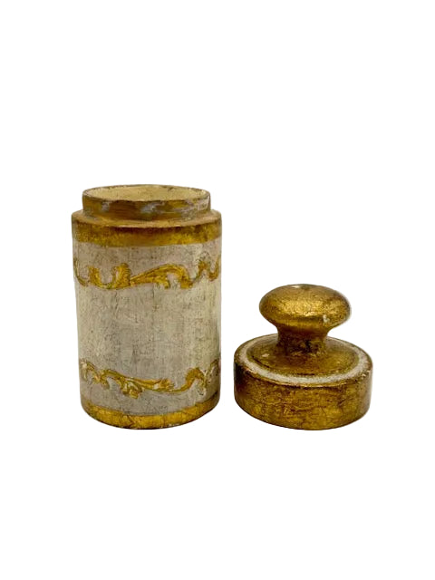 Florentine vanity canister with its domed lid removed and set beside the body.