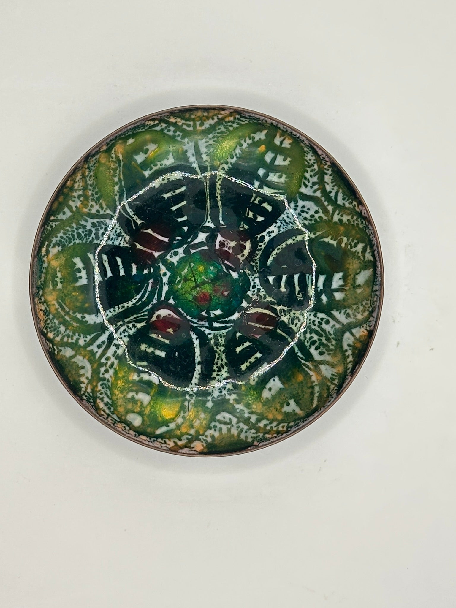 Doris Hall enamel dish, overhead view of vivid green and yellow abstract floral design