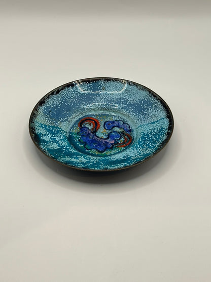 Doris Hall turquoise enamel-on-copper dish, angled view of blue and red abstract glaze center