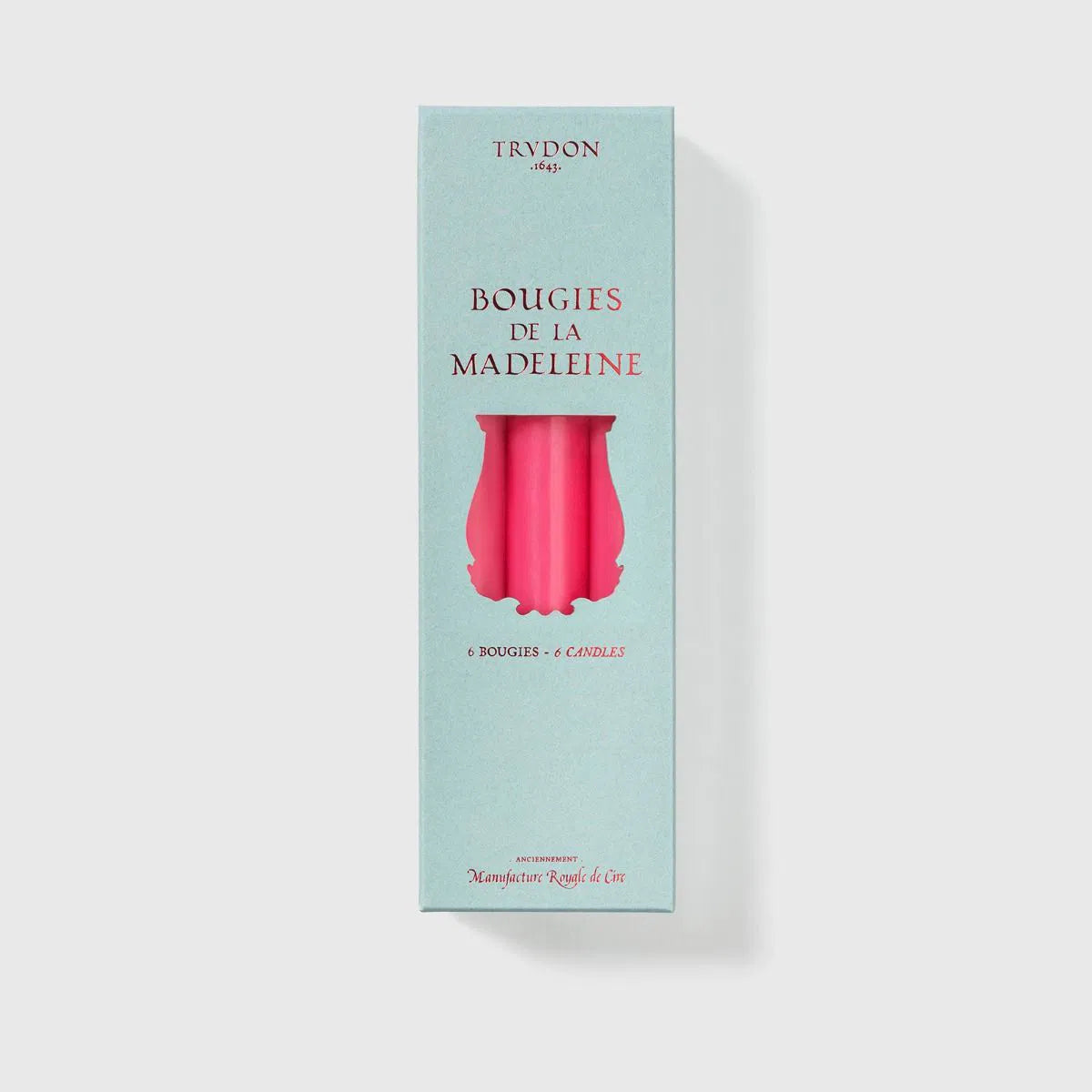 Pale aqua Trudon Madeleine box displaying fuchsia pink taper candles, six count