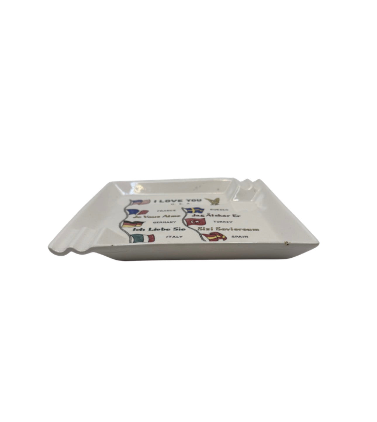 Side view of the white ceramic 'I Love You' flags ashtray showing rim rests