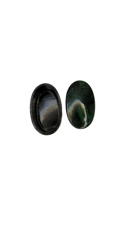 Faux malachite papier-mache box open from above, showing oval lid and dark interior