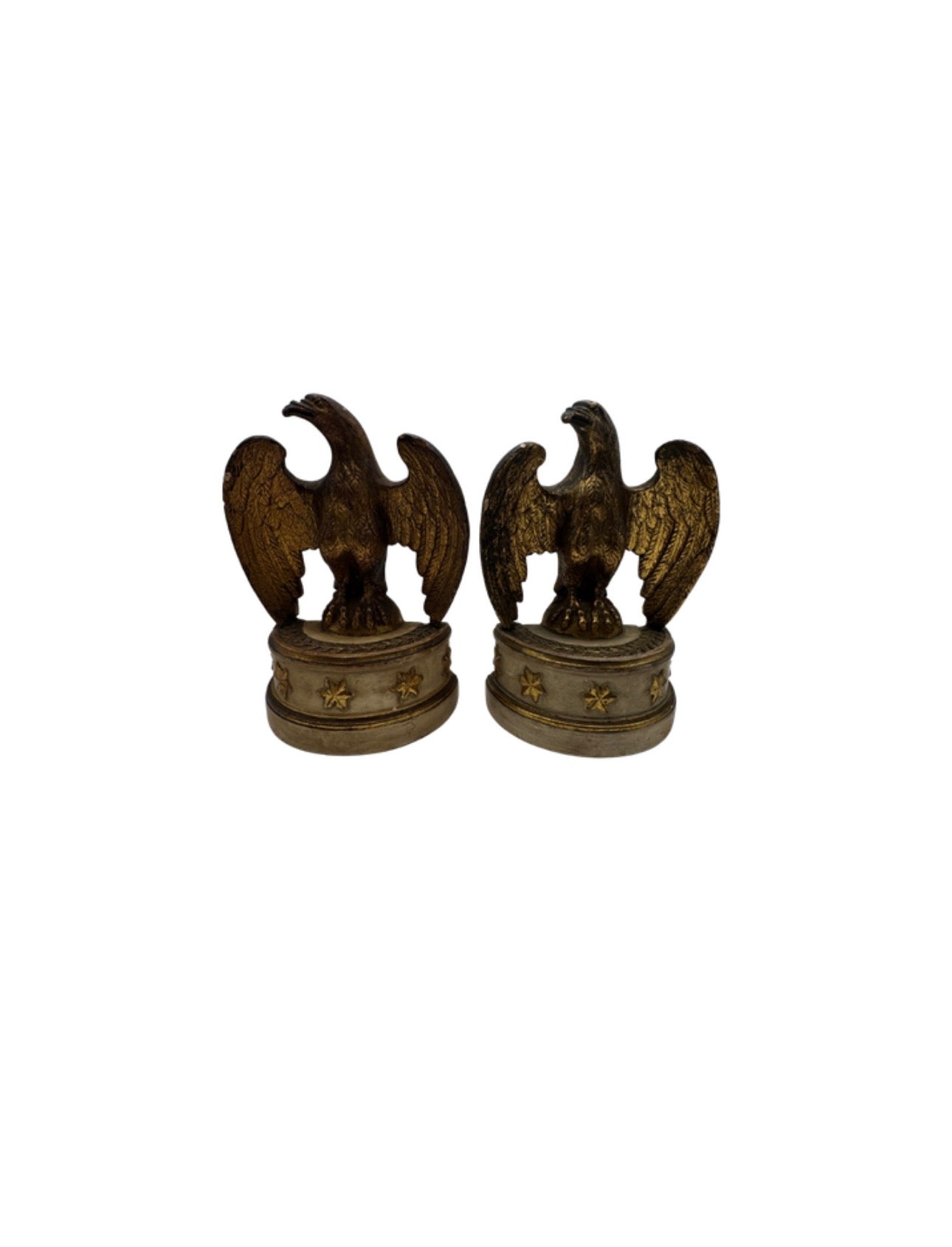 Pair of Borghese gilt eagle bookends facing each other on round star-studded pedestal bases