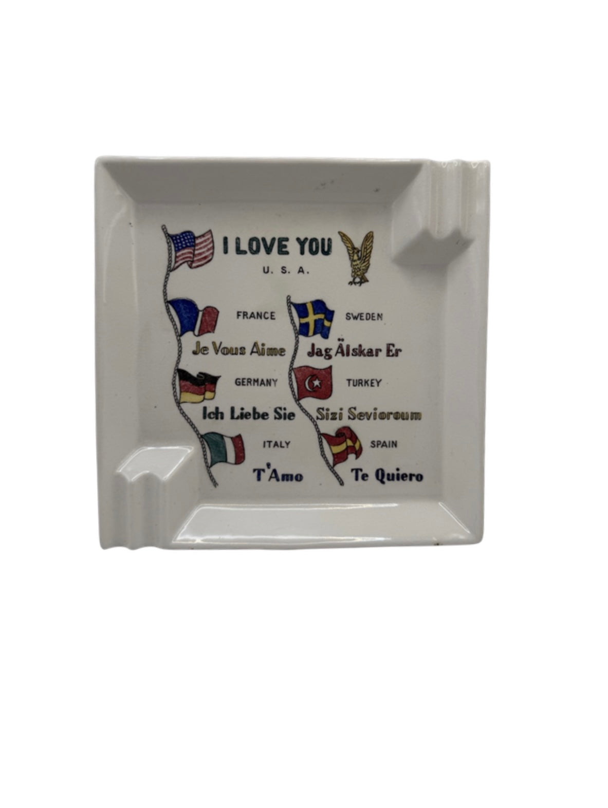 Ceramic ashtray printed with 'I Love You' in eight languages, national flags and gold eagle