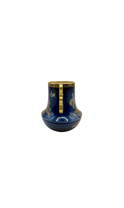 Back view of Carlton Ware cobalt chinoiserie vase showing gilt handle and ribbed base