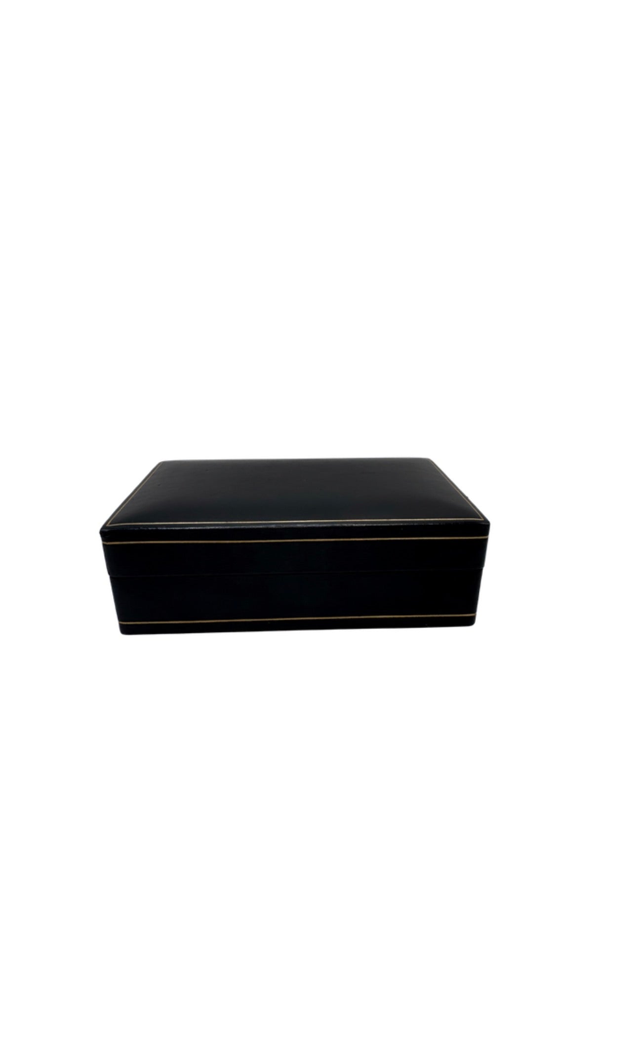 Vintage black leather box, lid closed, three-quarter view showing gilt-trimmed edges