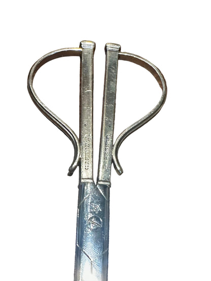 Close-up of grape shears' looped handles and stamped 'Cohr Denmark' maker's marks