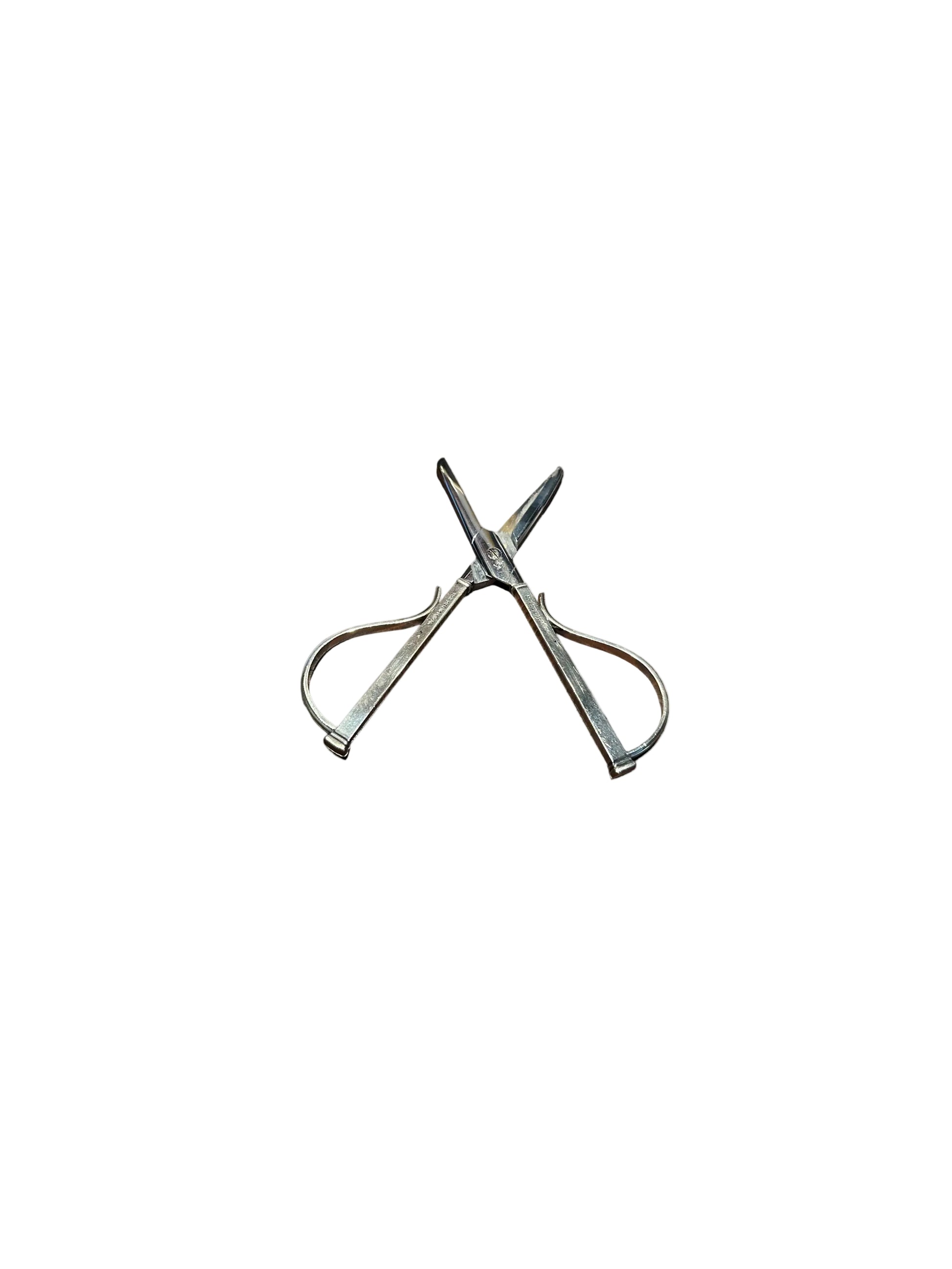 Sterling silver grape shears fully open in an X shape showing pointed cutting blades