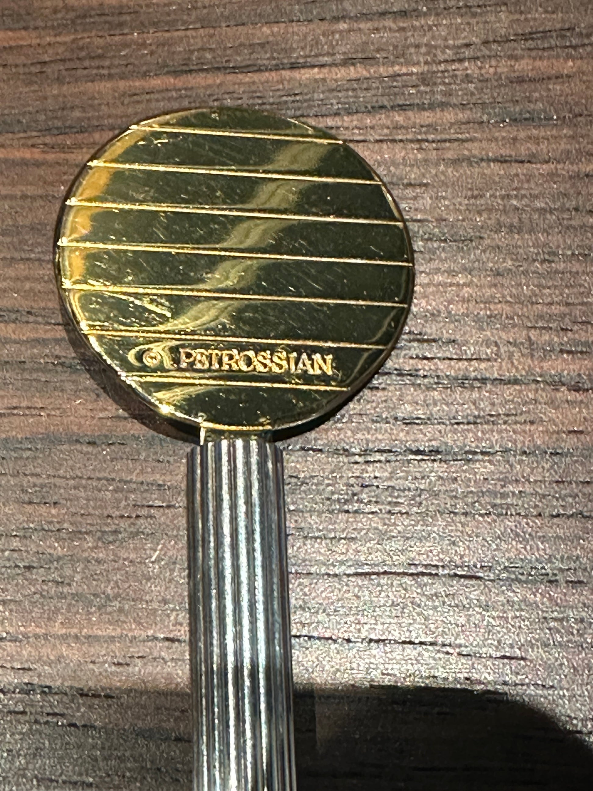 Detail of the Petrossian engraving on the gold-plated caviar paddle