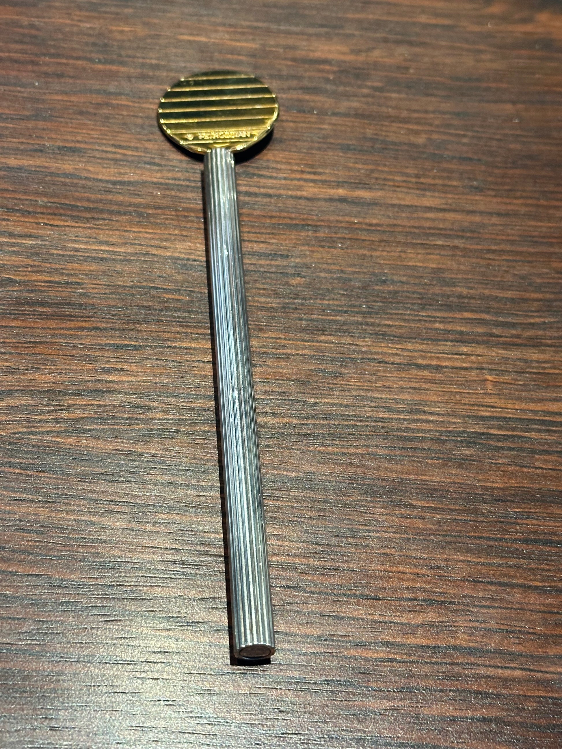 Gold-plated paddle of the Petrossian caviar spoon with ribbed silver handle