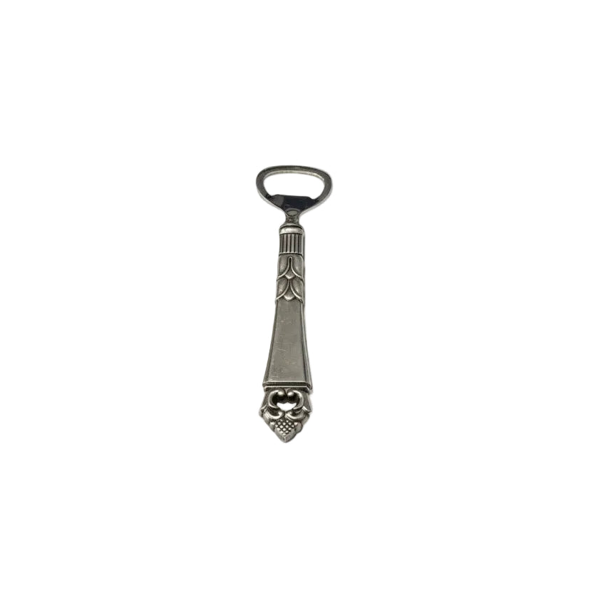Vintage Danish sterling-handled bottle opener with grape-cluster terminal, front view