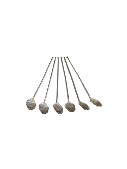 Sterling silver shell-shaped sipper spoons shown bowls downward