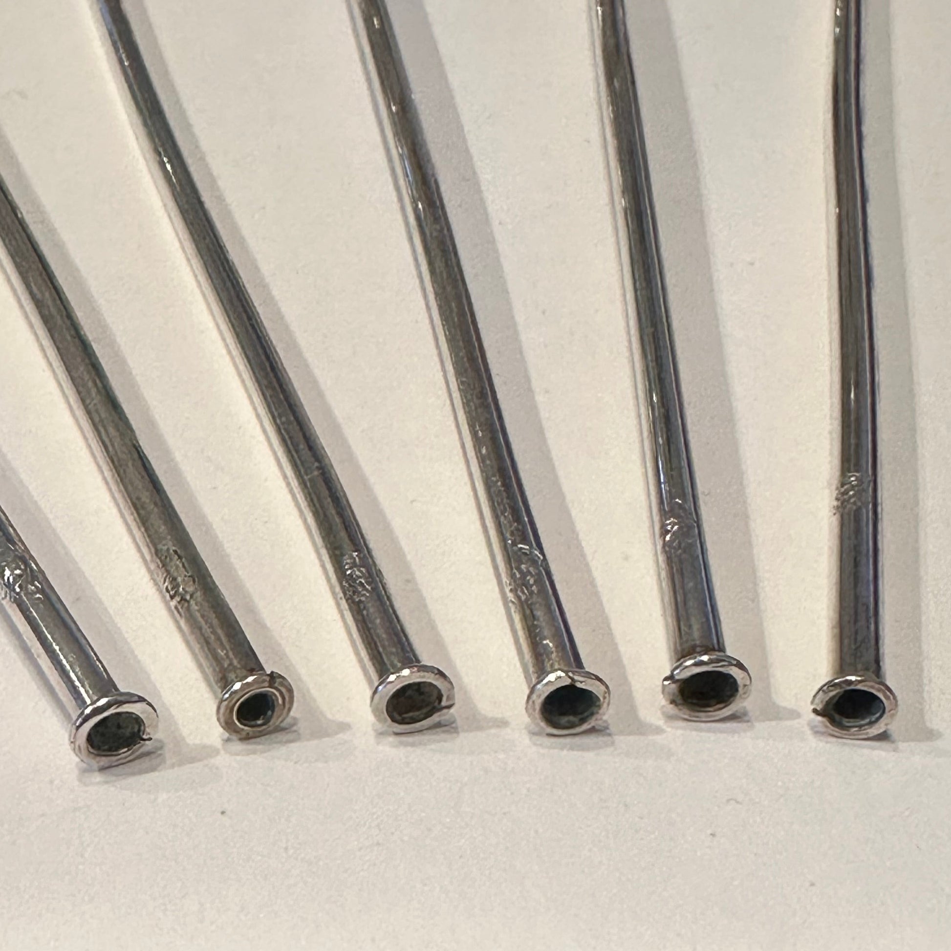 Close-up of the hollow straw ends of the sterling silver sipper handles