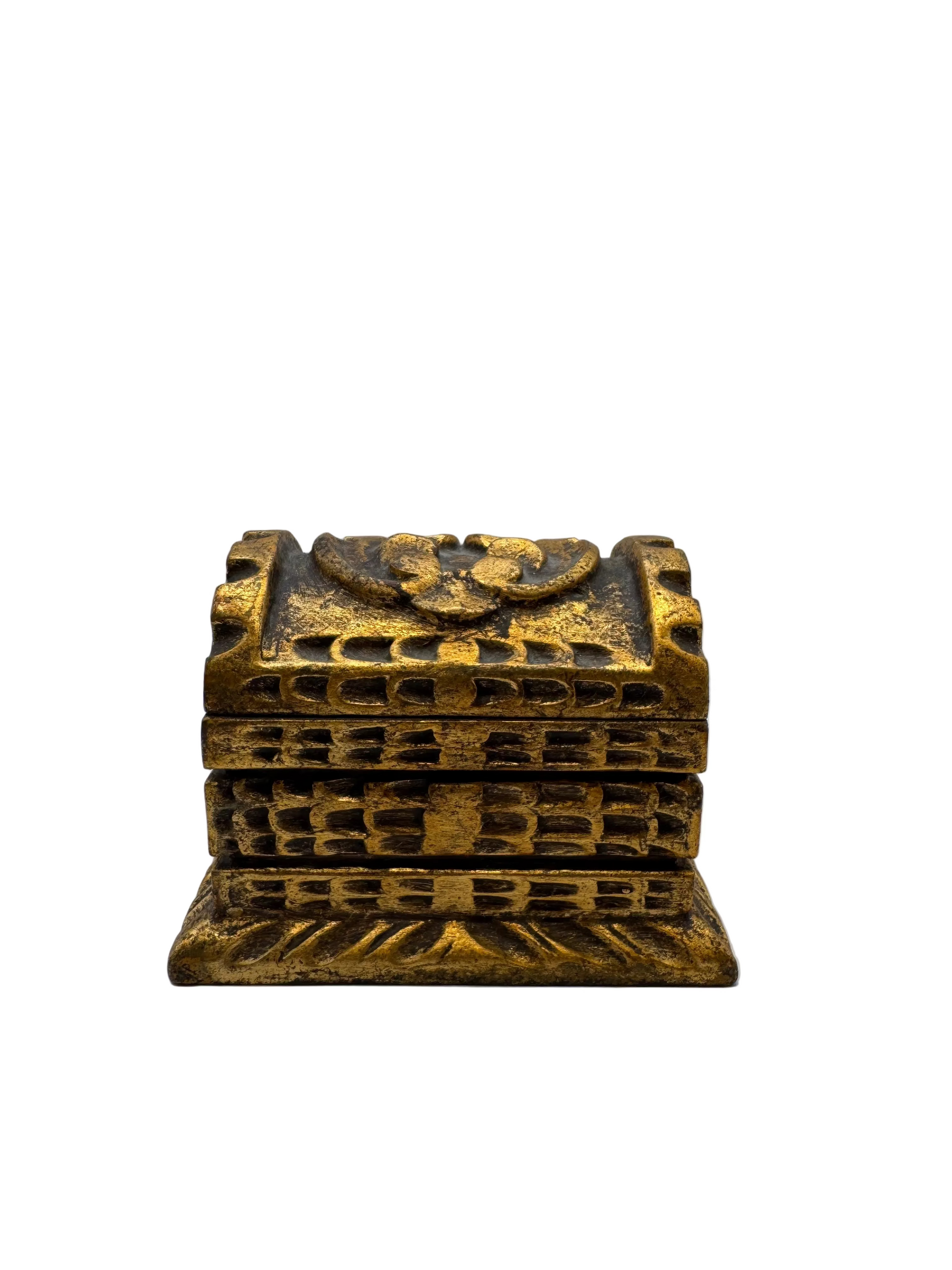 Gilt carved wood box with latticework sides and floral medallion on lid, front view.