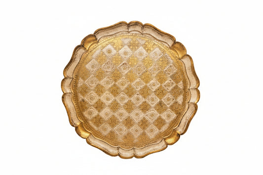 Round Florentine tray with gold checkerboard and floral pattern on scalloped rim, top view.