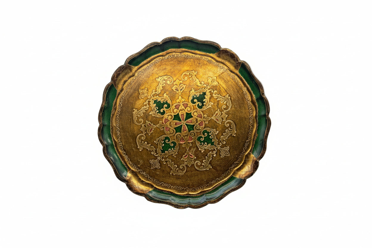 Round Florentine tray with gold scrollwork medallion on green scalloped border, top view.