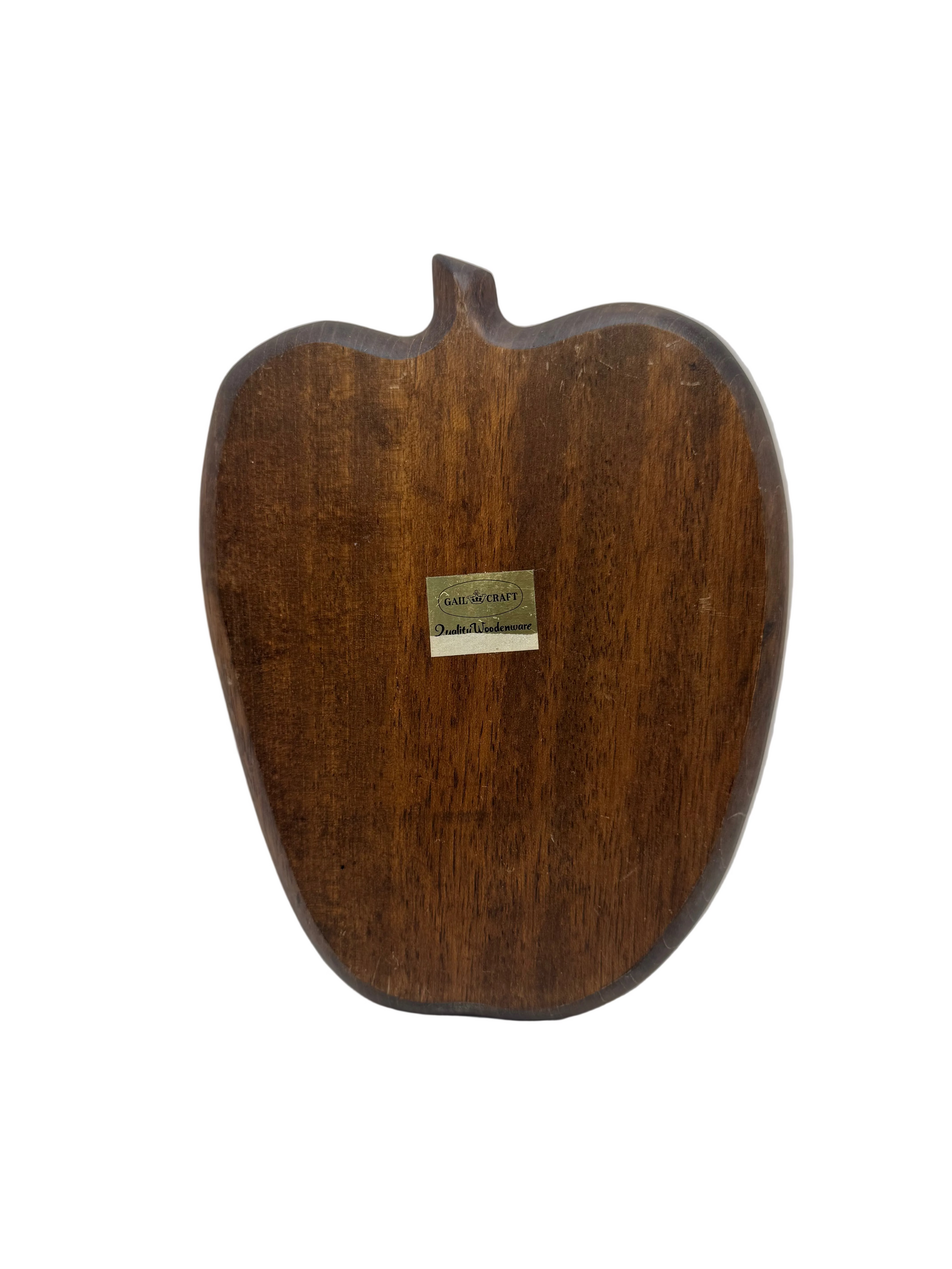 Underside of the apple-shaped wooden snack tray showing the Gailcraft maker's label