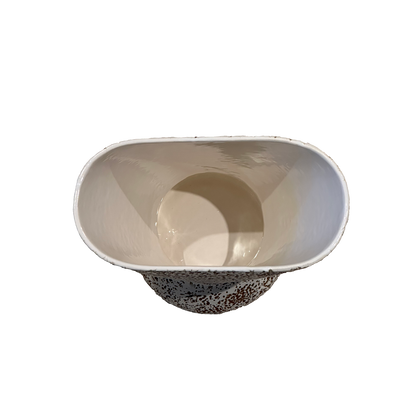 Top view into the vase showing its glossy cream interior