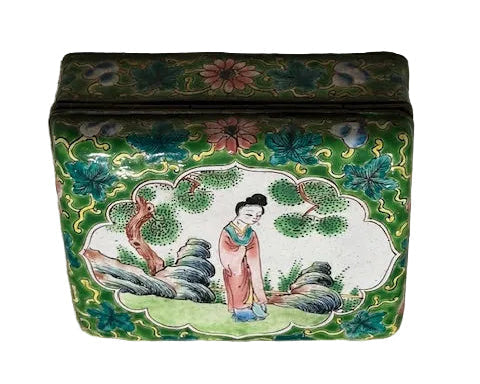 Front panel of the enamel hinged box, lid scene of a lady in a garden with floral borders