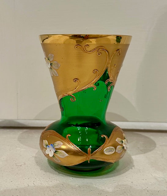 Emerald green and gold Bohemian vase shown from an alternate front angle