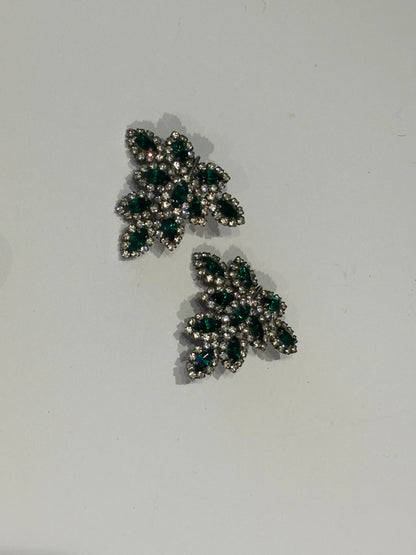 Vintage Les Bernard emerald and rhinestone leaf-shaped earrings, pair on light ground.