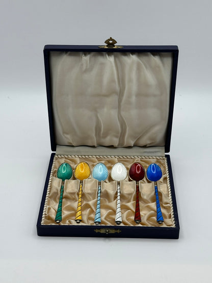 Vintage Ela of Denmark enamel demitasse spoon set of 6 in open navy box, multicolored guilloché bowls, front view.