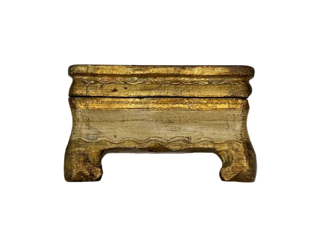 Front view of cream Florentine box with worn gilt edges and bracket feet