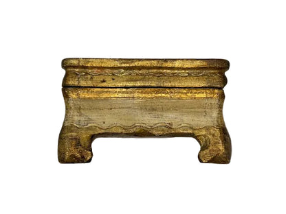 Front view of cream Florentine box with worn gilt edges and bracket feet