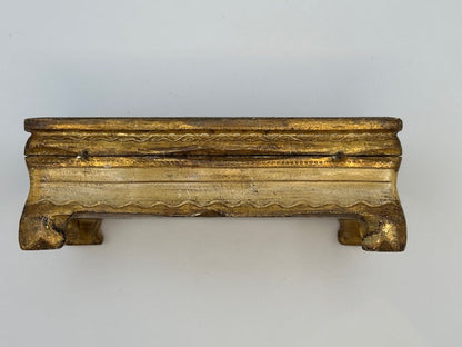 Side view of gilded Florentine box with hinged lid and scrolled feet