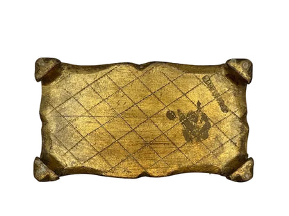 Underside of Florentine box with gold cross-hatch gilding and aging marks