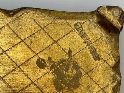 Close-up of Florentine box underside showing faint maker's stamp on gilt base