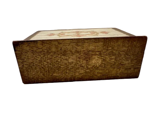 Angled view of Florentine letter holder showing wood-grain sides and floral painted top edge